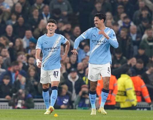 Manchester, England, 5th November 2025. Phil Foden of Manchester City (l) celebrates hi goal with Tijjani Reijnders of Manchester City (r) during the Manchester City vs Borussia Dortmund UEFA Champions League match at the Etihad Stadium, Manchester. Picture credit should read: Andrew Yates Sportimage EDITORIAL USE ONLY. No use with unauthorised audio, video, data, fixture lists, club league logos or live services. Online in-match use limited to 120 images, no video emulation. No use in betting, games or single club league player publications. SPI_022_AY_Man_City_Dortmund SPI-4268-0049