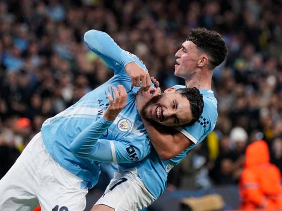 Manchester, England, 5th November 2025. Rayan Cherki of Manchester City (l) celebrates scoring their fourth goal with Phil Foden of Manchester City (r) during the Manchester City vs Borussia Dortmund UEFA Champions League match at the Etihad Stadium, Manchester. Picture credit should read: Andrew Yates Sportimage EDITORIAL USE ONLY. No use with unauthorised audio, video, data, fixture lists, club league logos or live services. Online in-match use limited to 120 images, no video emulation. No use in betting, games or single club league player publications. SPI_052_AY_Man_City_Dortmund SPI-4268-0110