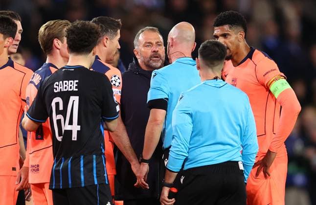 Brugge, Belgium, 5th November 2025. Barcelona players and Hansi Flick, manager of Barcelona show their frustration towards referee Anthony Taylor after during the Club Brugge vs FC Barcelona, Barca UEFA Champions League match at Jan Breydel Stadium, Brugge. Picture credit should read: Paul Terry Sportimage EDITORIAL USE ONLY. No use with unauthorised audio, video, data, fixture lists, club league logos or live services. Online in-match use limited to 120 images, no video emulation. No use in betting, games or single club league player publications. SPI_034_PT_Brugge_Barcelona SPI-4266-0034
