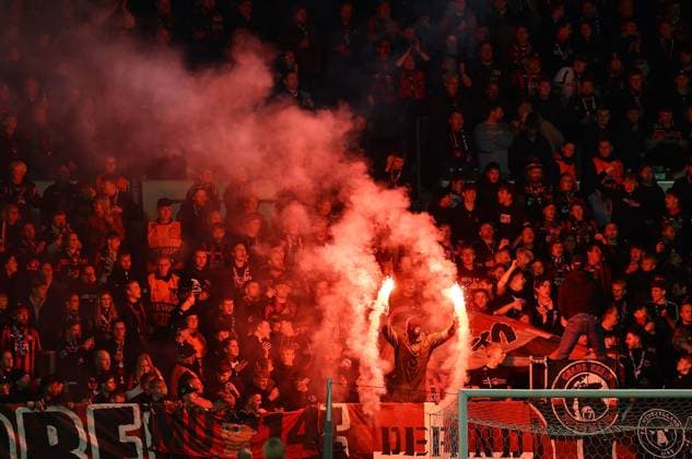 A fan of FC Midtjylland let off flares Midtjylland vs Celtic, UEFA Europa League, Group Stage, Football, MCH Arena, Herning, Denmark - 06 Nov 2025Herning MCH Arena Denmark EDITORIAL USE ONLY No use with unauthorised audio, video, data, fixture lists, club league logos or live services. Online in-match use limited to 120 images, no video emulation. No use in betting, games or single club league player publications. Copyright: xMichaelxZemanek Shutterstockx 15642247bd