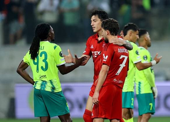 Nicolas Milanovic (centre) and Adil Aouchiche of Aberdeen with Jeremie Gnali of AEK Larnaca after their side s draw AEK Larnaca v Aberdeen, UEFA Conference League, Group Stage, Football, AEK Arena, Larnaca, Cyprus - 06 Nov 2025Larnaca AEK Arena Cyprus EDITORIAL USE ONLY No use with unauthorised audio, video, data, fixture lists, club league logos or live services. Online in-match use limited to 120 images, no video emulation. No use in betting, games or single club league player publications. Copyright: xCharaxSavvides Shutterstockx 15642241dq