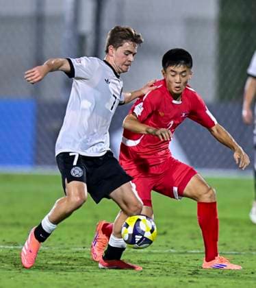 Germany v Korea DPR : Group G - FIFA U-17 World Cup Qatar 2025 Benjamin Ley (L) of Germany and SIl Bok Han of Korea DPR in action during the FIFA U-17 World Cup Qatar 2025 Group G match between Germany and Korea DPR in Doha, Qatar, on November 7, 2025. DOHA Qatar Copyright: xNOUSHADxTHEKKAYILx