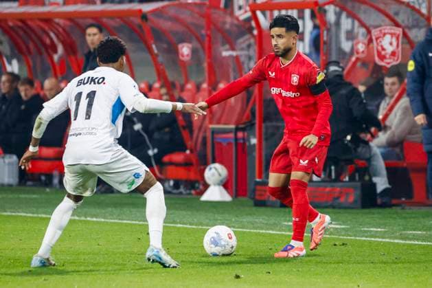 Naci Unuvar of FC Twente passes the ball under pressure from Tyrese Noslin of Telstar FC Twente v SC Telstar, Eredivisie, FC Twente 65 v Telstar 1963, De Grolsch Veste Stadium, November 7, 2025, Enschede, Netherlands.