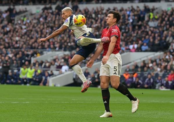 Spurs vs Man Utd, Premier League Richarlison of Tottenham Hotspur in a clash with Harry Maguire of Manchester United, ManU during the Spurs vs Man Utd, Premier League match at the Tottenham Hotspur Stadium London. London Tottenham Hotspur Stadium UK Copyright: xMartinxDaltonx Spurs_vs_ManUtd_081125_MD_442