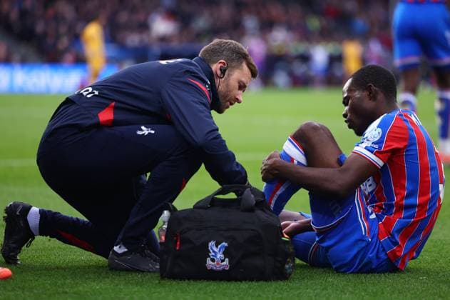 London, England, 9th November 2025. Tyrick Mitchell of Crystal Palace receives medical treatment during the Crystal Palace vs Brighton and Hove Albion Premier League match at Selhurst Park, London. Picture credit should read: Paul Terry Sportimage EDITORIAL USE ONLY. No use with unauthorised audio, video, data, fixture lists, club league logos or live services. Online in-match use limited to 120 images, no video emulation. No use in betting, games or single club league player publications. SPI_029_PT_Crystal_Palace_Brighton SPI-4277-0029