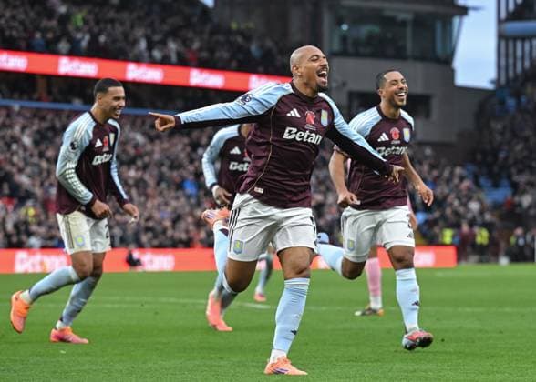 Birmingham, England, 9th November 2025. Donyell Malen of Aston Villacelebrates scoring his sides fourth goal during the Aston Villa vs AFC Bournemouth Premier League match at Villa Park, Birmingham. Picture credit should read: Cody Froggatt Sportimage EDITORIAL USE ONLY. No use with unauthorised audio, video, data, fixture lists, club league logos or live services. Online in-match use limited to 120 images, no video emulation. No use in betting, games or single club league player publications. SPI_047_CF_ASTON_VILLA_V_BOURNEMOUTH SPI-4279-0047