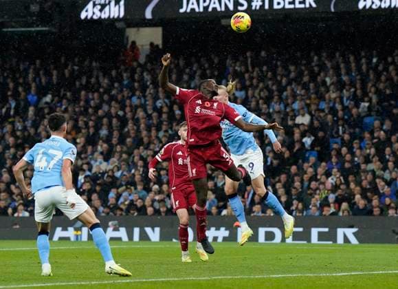 Manchester, England, 9th November 2025. Erling Haaland of Manchester City scores the first goal during the Manchester City vs Liverpool Premier League match at the Etihad Stadium, Manchester. Picture credit should read: Andrew Yates Sportimage EDITORIAL USE ONLY. No use with unauthorised audio, video, data, fixture lists, club league logos or live services. Online in-match use limited to 120 images, no video emulation. No use in betting, games or single club league player publications. SPI_044_AY_Man_City_Liverpool SPI-4280-0044