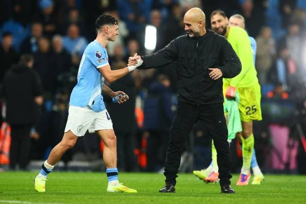 Manchester City manager Pep Guardiola with Phil Foden at the end of the match Manchester City v Liverpool, Premier League, Football, Etihad Stadium, Manchester, UK - 09 Nov 2025Manchester Etihad Stadium United Kingdom EDITORIAL USE ONLY No use with unauthorised audio, video, data, fixture lists, club league logos or live services. Online in-match use limited to 120 images, no video emulation. No use in betting, games or single club league player publications. Copyright: xPaulxCurrie Shutterstockx 15702266ed