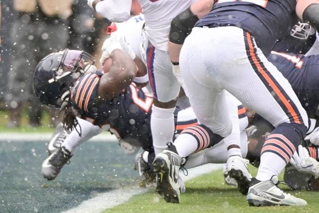 Chicago Bears running back Kyle Monangai (25) falls backwards into the end-zone for a first quarter touchdown against the New York Giants at Soldier Field in Chicago on Sunday, November 9, 2025.  CHI20251109102 MARKxBLACK
