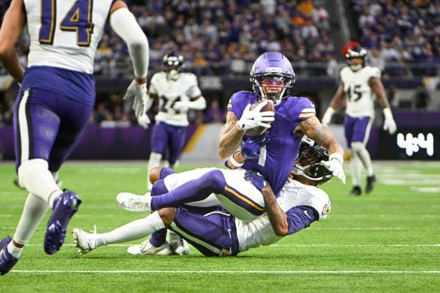 Minnesota Vikings wide receiver Jalen Nailor (L) is tackled by Baltimore Ravens cornerback Nate Wiggins (R) in the fourth quarter against the Minnesota Vikings at U.S. Bank Stadium in Minneapolis, Minnesota on Sunday, November 9, 2025.  MIN20251109113 CRAIGxLASSIG