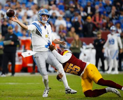 Nov 9, 2025, Landover, Maryland, USA: Detroit Lions quarterback JARED GOFF throws the ball before getting dragged down by Washington Commanders JACOB MARTIN DURING the Washington Commanders game against the Detroit Lions at Northwest Stadium in Landover. Landover USA - ZUMAc04_ 20251109_zma_c04_146 Copyright: xJustinxCooperx