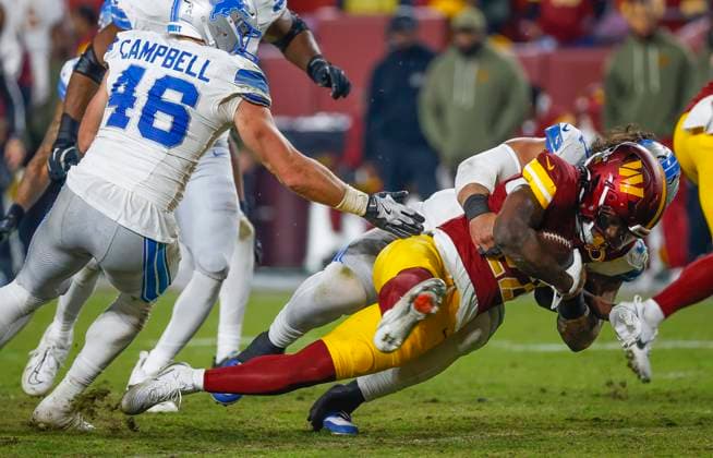 Nov 9, 2025: Washington Commanders RB 22 Jacory Croskey-Merritt is tossed back during the Washington Commanders game against the Detroit Lions at Northwest Stadium in Landover, MD. CSM Landover United States of America - ZUMAc04_ 20251109_zma_c04_242 Copyright: xJustinxCooperx