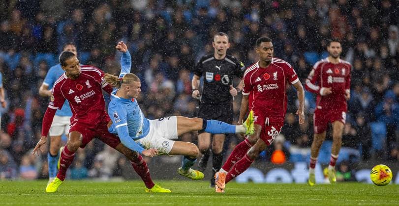 (251110) -- MANCHESTER, Nov. 10, 2025 -- Liverpool s captain Virgil van Dijk (front, L) challenges Manchester City s Erling Haaland during the English Premier League match between Manchester City FC and Liverpool FC in Manchester, Britain, on Nov. 9, 2025. FOR EDITORIAL USE ONLY. NOT FOR SALE FOR MARKETING OR ADVERTISING CAMPAIGNS. NO USE WITH UNAUTHORIZED AUDIO, VIDEO, DATA, FIXTURE LISTS, CLUB LEAGUE LOGOS OR LIVE SERVICES. ONLINE IN-MATCH USE LIMITED TO 45 IMAGES, NO VIDEO EMULATION. NO USE IN BETTING, GAMES OR SINGLE CLUB LEAGUE PLAYER PUBLICATIONS. (SP)BRITAIN-MANCHESTER-FOOTBALL-PREMIER LEAGUE-MANCHESTER CITY VS LIVERPOOL LixYing