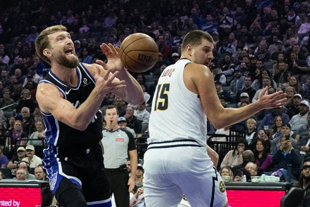 November 11, 2025, Sacramento, Ca, USA: Sacramento Kings center Domantas Sabonis (11) is fouled by Denver Nuggets center Nikola Jokic (15) during a game at the Golden 1 Center on Tuesday, Nov. 11, 2025, in Sacramento. Sacramento USA - ZUMAj89_ 20251111_zaf_j89_004 Copyright: xPaulxKitagakixJr.x