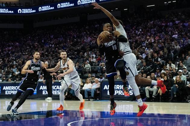 November 11, 2025, Sacramento, Ca, USA: Sacramento Kings guard Russell Westbrook (18) drives against Denver Nuggets forward Cameron Johnson (23) during a game at the Golden 1 Center on Tuesday, Nov. 11, 2025, in Sacramento. Sacramento USA - ZUMAj89_ 20251111_zaf_j89_008 Copyright: xPaulxKitagakixJr.x