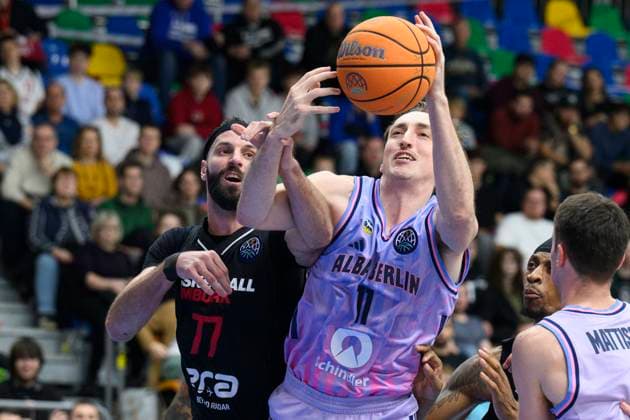 From left Vojtech Hruban of Nymburk and Moses Wood of Alba Berlin in action during the Basketball Champions League group B round 4 match Nymburk vs Alba Berlin in Prague, Czech Republic, November 12, 2025. (CTKxPhoto MichalxKamaryt) CTKPhotoP2025111207480  CTKPhotoP2025111207480