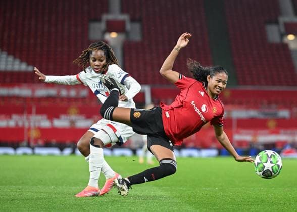 Manchester, England, 12th November 2025. Tara Elimbi Gilbert of Paris Saint-Germain fouls Jayde Riviere of Manchester United, ManU during the Manchester United Women vs Paris St Germain Women UEFA Womens Champions League match at Old Trafford, Manchester. Picture credit should read: Cody Froggatt Sportimage EDITORIAL USE ONLY. No use with unauthorised audio, video, data, fixture lists, club league logos or live services. Online in-match use limited to 120 images, no video emulation. No use in betting, games or single club league player publications. SPI_045_CF_MANCHESTER_UTD_WOMEN_V_PARIS_ST_GERMAIN_WOMEN SPI-4282-0045