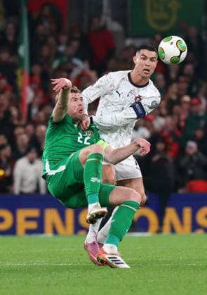 Cristiano Ronaldo of Portugal challenges Nathan Collins of the Republic of Ireland Republic of Ireland v Portugal, FIFA 2026 World Cup Qualifying, Group F, Football, Aviva Stadium, Dublin, Ireland - 13 Nov 2025Dublin Aviva Stadium Ireland EDITORIAL USE ONLY No use with unauthorised audio, video, data, fixture lists, club league logos or live services. Online in-match use limited to 120 images, no video emulation. No use in betting, games or single club league player publications.  Copyright: xLorrainexO Sullivan Shutterstockx 15759346ag