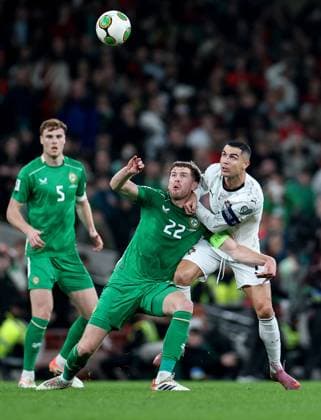 2026 FIFA World Cup, WM, Weltmeisterschaft, Fussball Qualifier Group F, Aviva Stadium, Dublin 13 11 2025 Republic of Ireland vs Portugal Ireland s Nathan Collins in action with Portugal s Cristiano Ronaldo Nathan Collins in action with Cristiano Ronaldo 13 11 2025  Copyright: x INPHO NickxElliottx IMG_9322