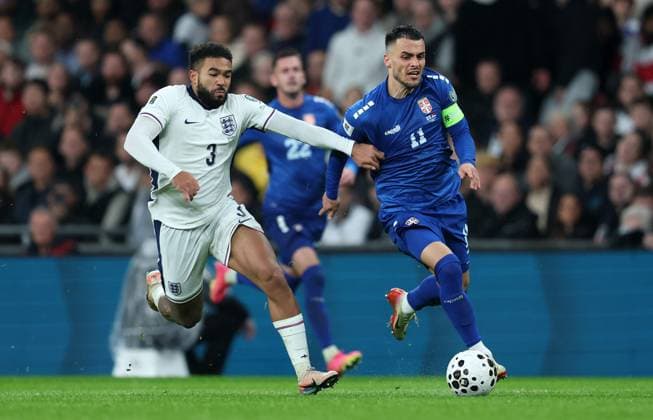Reece James of England with Filip Kostic of Serbia England v Serbia - UEFA World Cup Qualifiers - Group K. Football. Wembley Stadium, London. UK. 13 NOV 2025Wembley Wembley Stadium London United Kingdom Editorial use only  Copyright: xJASONPIX Shutterstockx 15785832df