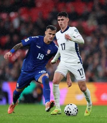Phil Foden of England with Aleksandar Stankovic of Serbia England v Serbia - UEFA World Cup Qualifiers - Group K. Football. Wembley Stadium, London. UK. 13 NOV 2025Wembley Wembley Stadium London United Kingdom Editorial use only  Copyright: xJASONPIX Shutterstockx 15785832fq
