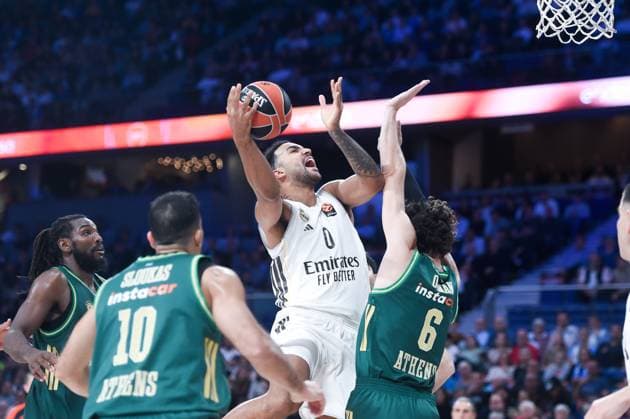 (251114) -- MADRID, Nov. 14, 2025 -- Trey Lyles (top) of Real Madrid goes for a layup during the regular season 11th round of the Euroleague basketball match between Real Madrid of Spain and Panathinaikos Aktor Athens of Greece at Movistar Arena in Madrid, Spain, on Nov. 13, 2025. (Photo by Gustavo Valiente Xinhua) (SP)SPAIN-MADRID-BASKETBALL-EUROLEAGUE-REAL MADRID VS PANATHINAIKOS AKTOR ATHENS ChengxMin 