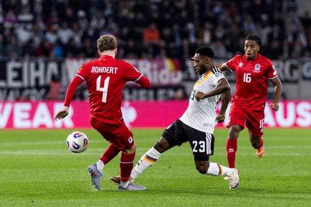 FIFA World Cup, WM, Weltmeisterschaft, Fussball UEFA Qualifiers: Luxembourg - Deutschland; 14.11.2025 Zweikampf Florian Bohnert (Luxembourg, 4), Ridle Baku (Deutschland, 23) FIFA World Cup UEFA Qualifiers: Luxembourg - Deutschland; Luxembourg, Stade de Luxembourg, 14.11.2025 Copyright: xBEAUTIFULxSPORTS Wunderlx