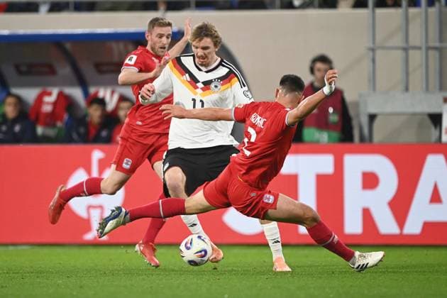 Nick WOLTEMADE (GER) gegen Seid KORAC (LUX) Aktion, Zweikampf, Luxemburg (LUX - Deutschland (GER) Fussball Laenderspiel, WM Qualifikation Europa Gruppe A, Spieltag 9, matchday9, am 14.1.2025, Stade de Luxembourg, Luxemburg, Â