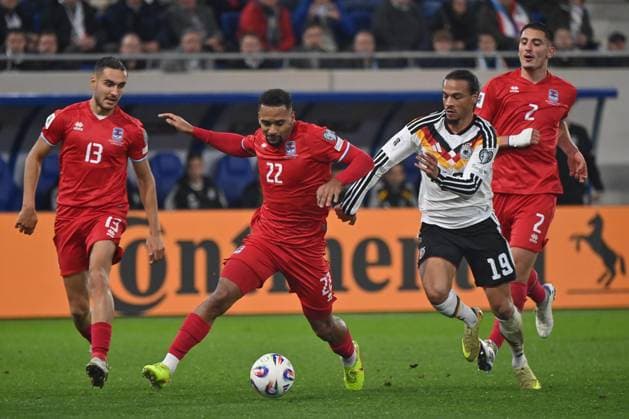 14.11.2025, xjrdrx, Fussball, WM-Qualifikation 2026 Luxemburg - Deutschland emspor, v.l. Dirk Carlson (Luxemburg, 13), Marvin Martins (Luxemburg, 22), Leroy Sane (Deutschland), Seid Korac (Luxemburg, 2) Zweikampf, Duell, Kampf, tackle (DFL DFB REGULATIONS PROHIBIT ANY USE OF PHOTOGRAPHS as IMAGE SEQUENCES and or QUASI-VIDEO) Luxemburg