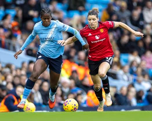 15th November 2025; Etihad Stadium, Manchester, England; Womens Super League Football, Manchester City versus Manchester United, ManU Khadija Shaw of Manchester City Women under pressure from Dominique Janssen of Manchester United Women  TimxWilliams