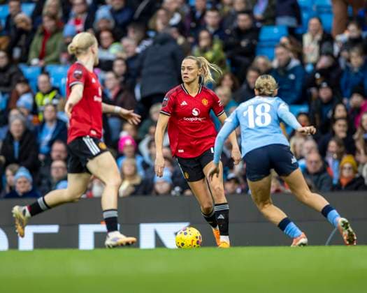 15th November 2025; Etihad Stadium, Manchester, England; Womens Super League Football, Manchester City versus Manchester United, ManU Fridolina Rolfo of Manchester United Women under pressure from Kerstin Casparji of Manchester City Women  TimxWilliams