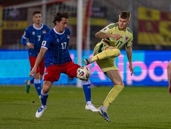 Football - FIFA World Cup, WM, Weltmeisterschaft, Fussball 2026 Qualifying - Group J - Liechtenstein v Wales VADUZ, LIECHTENSTEIN - Saturday, November 15, 2025: Wales Jordan James (R) is challenged by Liechtenstein s Simon Lüchinger during the FIFA World Cup 2026 Qualifying Group J match between Liechtenstein and Wales at the Rheinpark Stadion. (Photo by David Rawcliffe Propaganda) VADUZ Rheinpark Stadion VADUZ LIECHTENSTEIN  Copyright: xDavidxRawcliffex P2025-11-15-Liechenstein_Wales-61