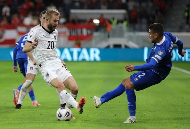 Cyprus Austria WCup Soccer Austria s Konrad Laimer, left, and Cyprus Andreas Shikkis fight for the ball during the World Cup 2026 group H qualifying soccer match between Cyprus and Austria, in Limassol, Cyprus, Saturday, Nov. 15, 2025 Limassol Cyprus  Copyright: xDanilxShamkinx originalFilename:shamkin-notitle251115_npZuU.jpg