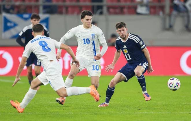 Connor Barron of Scotland with Christos Tzolis and Fotis Ioannidis of Greece Greece v Scotland, FIFA 2026 World Cup Qualifying, Group C, Football, Georgios Karaiskakis Stadium, Athens, Greece - 15 Nov 2025Athens Georgios Karaiskakis Stadium Greece EDITORIAL USE ONLY No use with unauthorised audio, video, data, fixture lists, club league logos or live services. Online in-match use limited to 120 images, no video emulation. No use in betting, games or single club league player publications. Copyright: xNikolaxKrstic Shutterstockx 15786160dc