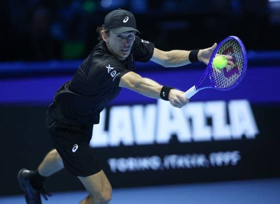 (251116) -- TURIN, Nov. 16, 2025 -- Alex De Minaur returns a shot during the men s singles semifinal match between Jannik Sinner of Italy and Alex De Minaur of Australia at the ATP, Tennis Herren Finals tennis tournament in Turin, Italy, on Nov. 15, 2025. ) (SP) ITALY-TURIN-ATP FINALS-MEN S SINGLES-SEMIFINAL LixJing 
