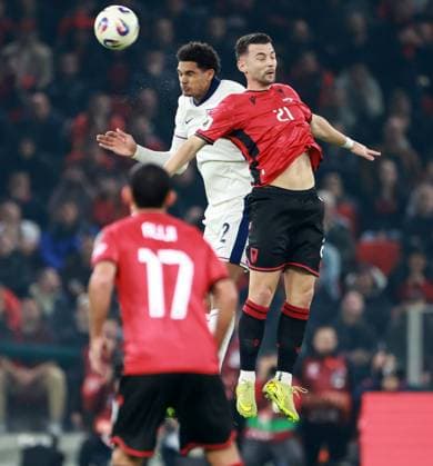 Jarell Quansah of England and Arber Hoxha of Albania. Albania v England, FIFA 2026 World Cup Qualifying, Group K, Football, Arena Kombetare, Tirana, Albania - 16 Nov 2025Tirana Arena Kombetare Albania EDITORIAL USE ONLY No use with unauthorised audio, video, data, fixture lists, club league logos or live services. Online in-match use limited to 120 images, no video emulation. No use in betting, games or single club league player publications.  Copyright: xNikolaxKrstic Shutterstockx 15786244t