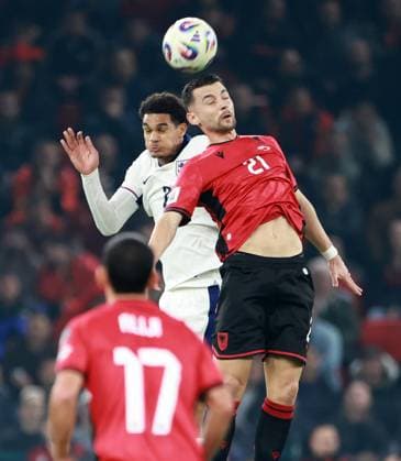 Jarell Quansah of England and Arber Hoxha of Albania. Albania v England, FIFA 2026 World Cup Qualifying, Group K, Football, Arena Kombetare, Tirana, Albania - 16 Nov 2025Tirana Arena Kombetare Albania EDITORIAL USE ONLY No use with unauthorised audio, video, data, fixture lists, club league logos or live services. Online in-match use limited to 120 images, no video emulation. No use in betting, games or single club league player publications.  Copyright: xNikolaxKrstic Shutterstockx 15786244u