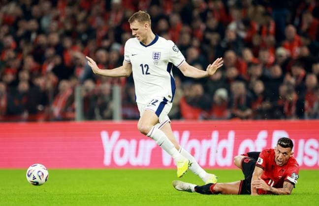 Dan Burn of England and Myrto Uzuni of Albania. Albania v England, FIFA 2026 World Cup Qualifying, Group K, Football, Arena Kombetare, Tirana, Albania - 16 Nov 2025Tirana Arena Kombetare Albania EDITORIAL USE ONLY No use with unauthorised audio, video, data, fixture lists, club league logos or live services. Online in-match use limited to 120 images, no video emulation. No use in betting, games or single club league player publications.  Copyright: xNikolaxKrstic Shutterstockx 15786244ad