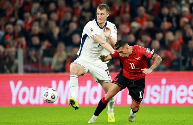 Dan Burn of England and Myrto Uzuni of Albania. Albania v England, FIFA 2026 World Cup Qualifying, Group K, Football, Arena Kombetare, Tirana, Albania - 16 Nov 2025Tirana Arena Kombetare Albania EDITORIAL USE ONLY No use with unauthorised audio, video, data, fixture lists, club league logos or live services. Online in-match use limited to 120 images, no video emulation. No use in betting, games or single club league player publications.  Copyright: xNikolaxKrstic Shutterstockx 15786244z