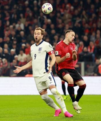 Harry Kane of England and Ardian Ismajli of Albania. Albania v England, FIFA 2026 World Cup Qualifying, Group K, Football, Arena Kombetare, Tirana, Albania - 16 Nov 2025Tirana Arena Kombetare Albania EDITORIAL USE ONLY No use with unauthorised audio, video, data, fixture lists, club league logos or live services. Online in-match use limited to 120 images, no video emulation. No use in betting, games or single club league player publications.  Copyright: xNikolaxKrstic Shutterstockx 15786244ax