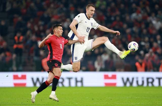 Myrto Uzuni of Albania and Dan Burn of England. Albania v England, FIFA 2026 World Cup Qualifying, Group K, Football, Arena Kombetare, Tirana, Albania - 16 Nov 2025Tirana Arena Kombetare Albania EDITORIAL USE ONLY No use with unauthorised audio, video, data, fixture lists, club league logos or live services. Online in-match use limited to 120 images, no video emulation. No use in betting, games or single club league player publications.  Copyright: xNikolaxKrstic Shutterstockx 15786244br