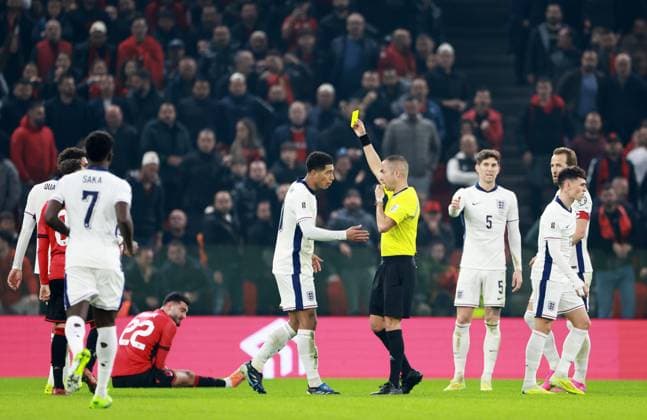 Jude Bellingham of England is shown a yellow card. Albania v England, FIFA 2026 World Cup Qualifying, Group K, Football, Arena Kombetare, Tirana, Albania - 16 Nov 2025Tirana Arena Kombetare Albania EDITORIAL USE ONLY No use with unauthorised audio, video, data, fixture lists, club league logos or live services. Online in-match use limited to 120 images, no video emulation. No use in betting, games or single club league player publications.  Copyright: xNikolaxKrstic Shutterstockx 15786244cq