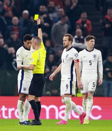 Jude Bellingham of England is shown a yellow card. Albania v England, FIFA 2026 World Cup Qualifying, Group K, Football, Arena Kombetare, Tirana, Albania - 16 Nov 2025Tirana Arena Kombetare Albania EDITORIAL USE ONLY No use with unauthorised audio, video, data, fixture lists, club league logos or live services. Online in-match use limited to 120 images, no video emulation. No use in betting, games or single club league player publications.  Copyright: xNikolaxKrstic Shutterstockx 15786244cu