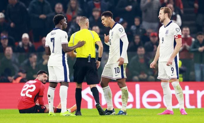 Jude Bellingham of England is shown a yellow card. Albania v England, FIFA 2026 World Cup Qualifying, Group K, Football, Arena Kombetare, Tirana, Albania - 16 Nov 2025Tirana Arena Kombetare Albania EDITORIAL USE ONLY No use with unauthorised audio, video, data, fixture lists, club league logos or live services. Online in-match use limited to 120 images, no video emulation. No use in betting, games or single club league player publications.  Copyright: xNikolaxKrstic Shutterstockx 15786244cv