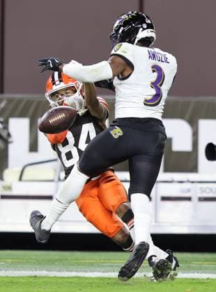 Baltimore Ravens Chidobe Awuzie (3) breaks up a pass in tended for Cleveland Browns Gage Larvadain (84) during the fourth quarter at Huntington Bank Field in Cleveland, Ohio on Sunday November 16, 2025.  CLE20251116123 AARONxJOSEFCZYK
