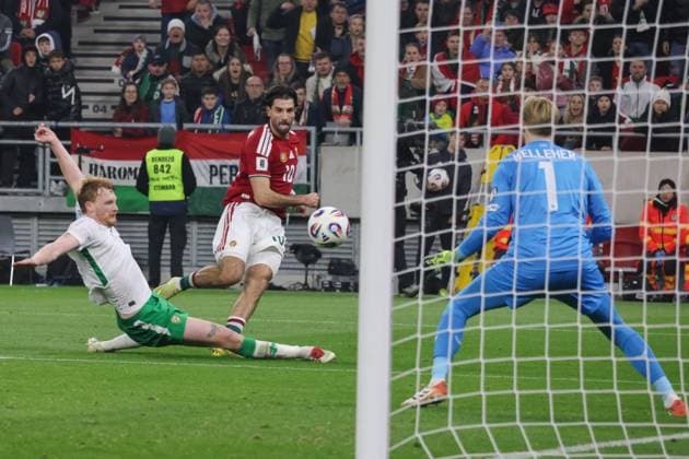 (251117) -- BUDAPEST, Nov. 17, 2025 -- Liam Scales (L) of Ireland vies with Dominik Szoboszlai (C) of Hungary during the FIFA World Cup, WM, Weltmeisterschaft, Fussball 2026 European qualifiers football match between Hungary and Ireland in Budapest, Hungary, on Nov. 16, 2025. (Photo by Xinhua) (SP)HUNGARY-BUDAPEST-FOOTBALL-2026 WORLD CUP EUROPEAN QUALIFIERS-HUNGARY VS IRELAND AttilaxVolgyi 
