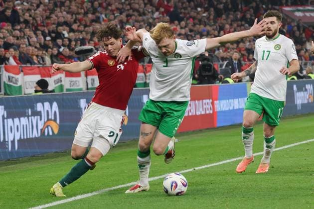 (251117) -- BUDAPEST, Nov. 17, 2025 -- Alex Toth (L) of Hungary vies with Liam Scales (C) of Ireland during the FIFA World Cup, WM, Weltmeisterschaft, Fussball 2026 European qualifiers football match between Hungary and Ireland in Budapest, Hungary, on Nov. 16, 2025. (Photo by Xinhua) (SP)HUNGARY-BUDAPEST-FOOTBALL-2026 WORLD CUP EUROPEAN QUALIFIERS-HUNGARY VS IRELAND AttilaxVolgyi 
