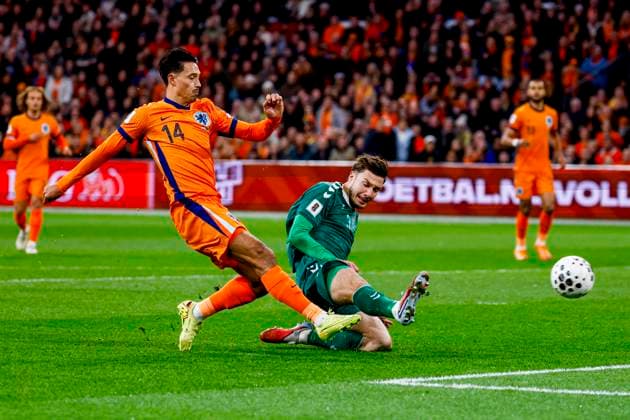 Tijjani Reijnders of the Netherlands shoots under pressure from Edgaras Utkus of Lithuania and scores the 1-0 Netherlands v Lithuania, FIFA World Cup, WM, Weltmeisterschaft, Fussball 2026 Qualifier, Netherlands v Lithuania, Johan Cruijff Arena, November 17, 2025, Amsterdam, Netherlands.