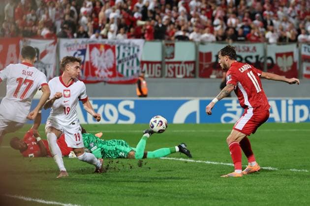 Irvin Cardona (right) of Malta shoots to score the 1-1 goal during the FIFA World Cup, WM, Weltmeisterschaft, Fussball 26 UEFA European Qualifier Group G match between Malta and Poland, at the National Stadium, in Ta Qali, Malta, 17 November 2025. FIFA World Cup 26 Qualifiers - Malta vs Poland