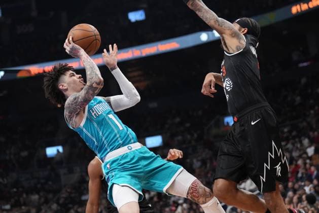 November 17, 2025, Toronto, On, CANADA: Charlotte Hornets guard Lamelo Ball (1) takes a shot as Toronto Raptors forward Brandon Ingram (3) defends during first half NBA, Basketball Herren, USA basketball action in Toronto on Monday, November 17, 2025. Canada News - November 17, 2025  - ZUMAc35_ 20251117_zaf_c35_157 Copyright: xNathanxDenettex